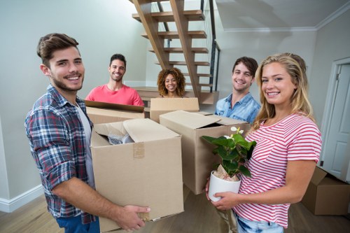 Team member using safe lifting techniques during a move