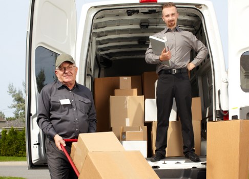 Professional moving crew following a safety-focused work routine