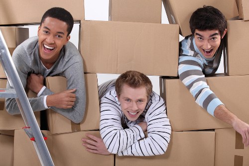 Furniture being carried through a narrow flat staircase