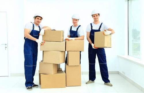 Professional movers loading furniture for a house move