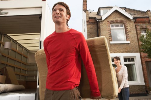 Local moving team loading boxes into a van in Finsbury Park