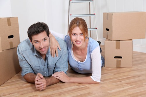 Team organising desks and IT equipment for an office relocation