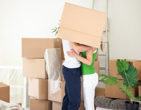 Local removal service team preparing furniture for transport