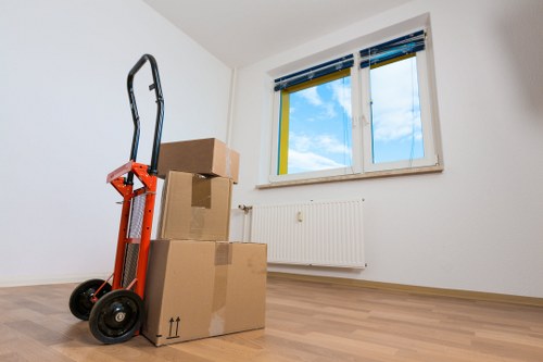 Professional movers handling furniture in Finsburypark