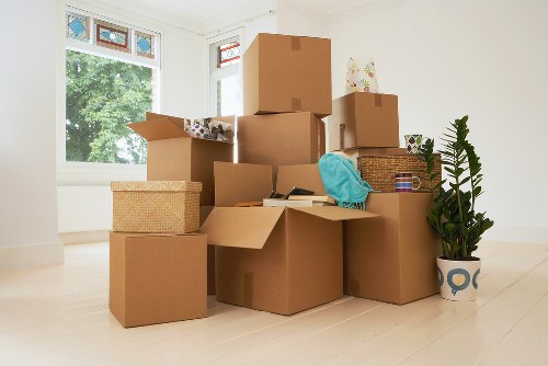 Family preparing boxes for removal truck hire