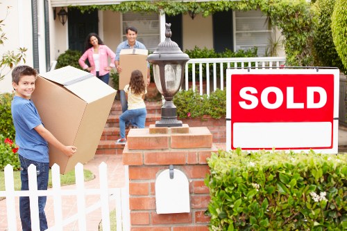 Local removals team handling boxes and furniture near Finsbury Park